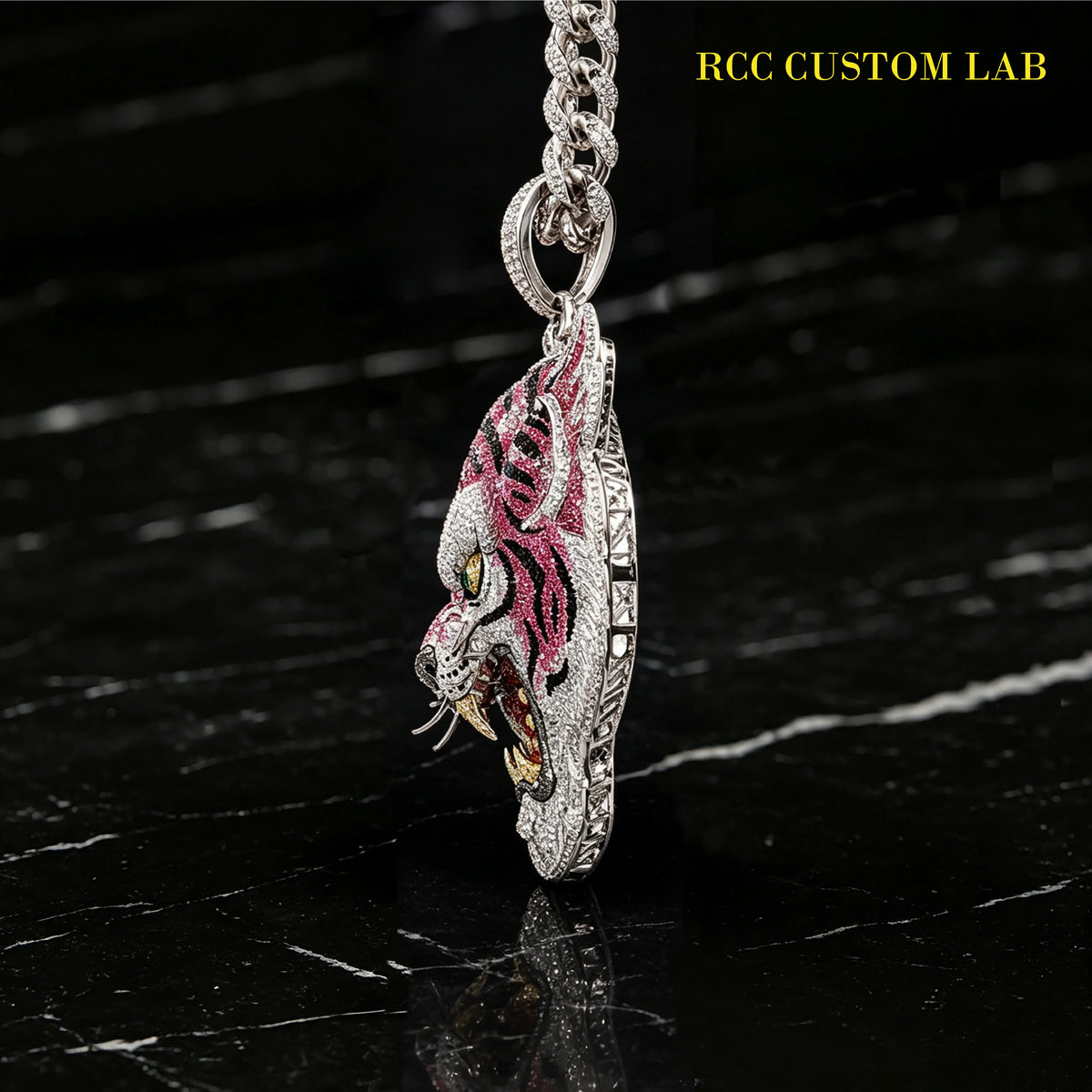 Side profile shot of silver iced out pink enamel tiger head pendant, detailed facial features and sharp fangs, custom moissanite hip hop pendant hanging on full diamond cuban chain