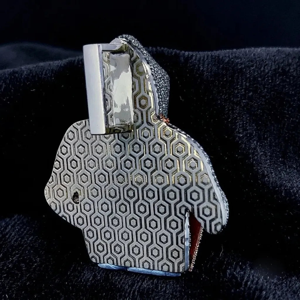 Back view of iced hooded hacker pendant, featuring precision hexagon textured pattern and polished silver bail, detailed craftsmanship shot on soft black velvet fabric