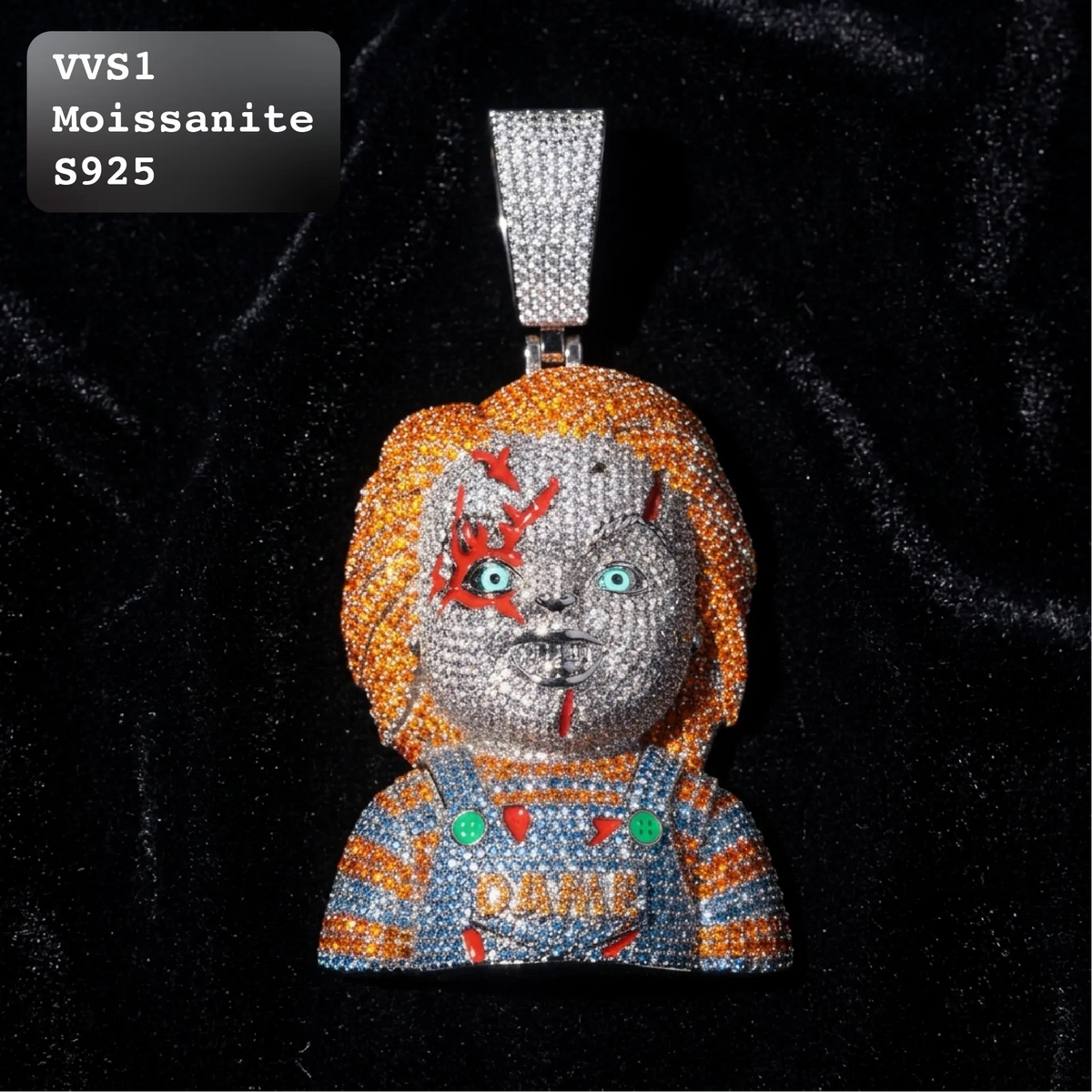 A Chucky moissanite pendant on a black velvet background, featuring a silver bail. The pendant is covered in clear moissanite crystals, depicting Chucky with orange hair, a gray face with red scratches, and a blue and orange striped shirt with 'DAME' written on it.