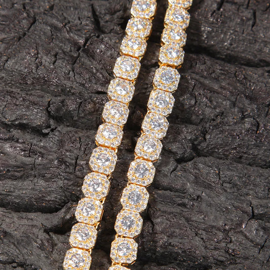 Macro close-up of gold plated square halo cluster moissanite chain, stacked icy links with double row stone setting, luxury hip hop jewelry texture