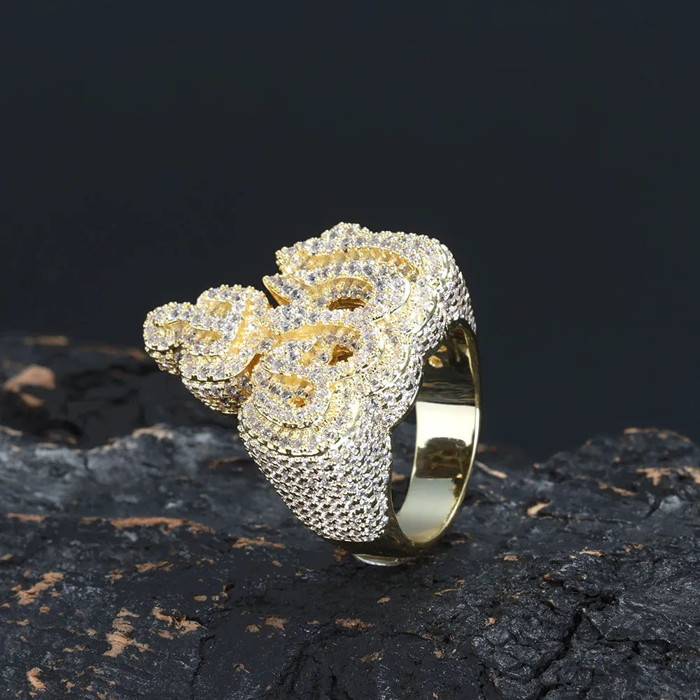Yellow gold fully paved moissanite 3D Allah arabic calligraphy ring, wide densely iced band, luxury muslim hip hop bling ring on textured dark rock surface