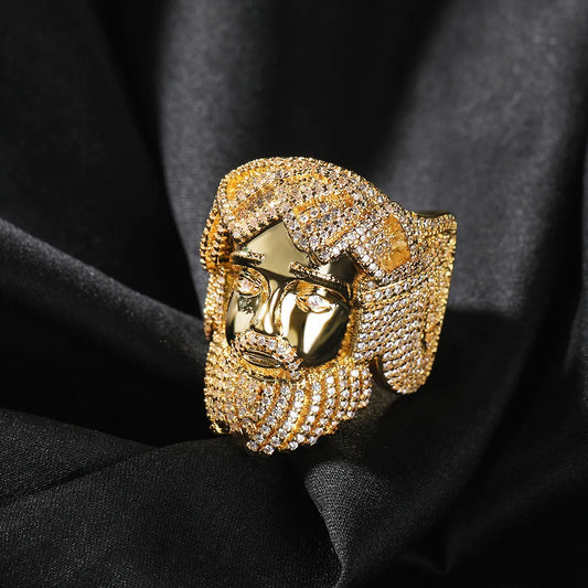Yellow gold plated icy Jesus head ring, detailed 3D sculpted face surrounded by densely paved round stones, premium mens hip hop bling religious jewelry on black satin