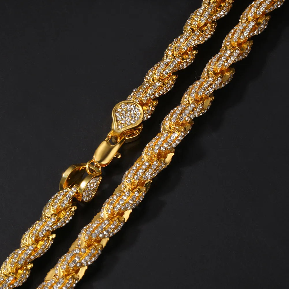 Close-up shot of gold iced moissanite rope chain, showcasing twisted stone encrusted links and decorated lobster clasp, icy hip hop jewelry detail