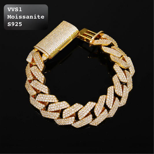 A gold-toned Cuban link chain bracelet paved with small clear stones, displayed on a black reflective surface. A text label in the top-left corner reads 'VVS1 Moissanite S925'.