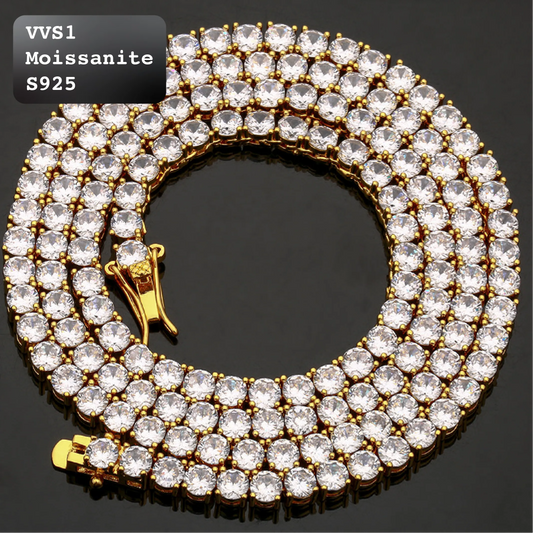 A gold-tone 5-row diamond back chain necklace, also known as a moissanite tennis necklace, featuring clear round-cut stones in a gold setting. The necklace is coiled on a black reflective surface, with a gold clasp visible.