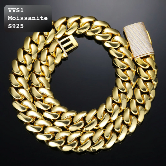 A thick gold-tone Cuban link chain necklace coiled on a black background, with a textured light beige clasp visible on the right. Text in the top-left corner reads 'VVS1 Moissanite S925'.