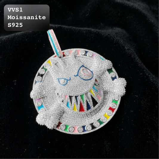 Front view of iced out 3D cartoon monster disc pendant with colorful enamel grill teeth and rainbow border in VVS1 moissanite S925 sterling silver.
