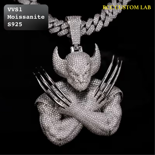 A custom rhinestone-encrusted pendant necklace featuring a devil-like figure with crossed arms and metallic claw-like fingers, shown on a black background with a matching chain. Text overlays read 'VVS1 Moissanite S925' and 'RCC CUSTOM LAB'.
