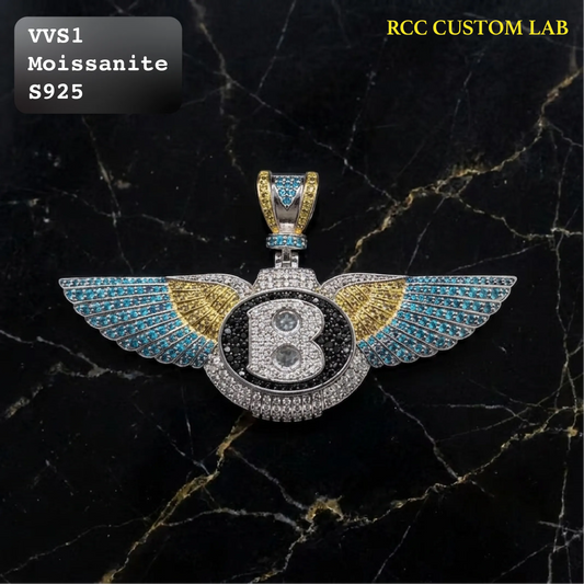 Iced out Bentley logo pendant featuring blue and yellow paved wings with letter B in VVS1 moissanite and S925 sterling silver.