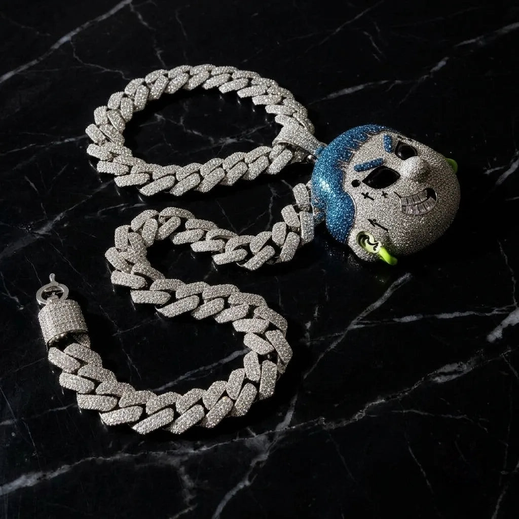 Iced out blue hair cartoon head pendant attached to a heavy paved cuban link chain in VVS1 moissanite and S925 sterling silver.