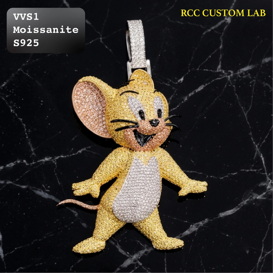 A custom mouse-shaped keychain or bag charm encrusted with yellow gold and silver moissanite, displayed on a black marble background with text overlays indicating the material and brand.