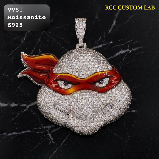 A custom pendant shaped like a cloud, heavily paved with clear stones and featuring red and orange enamel details, displayed on a black marble background with text overlays.