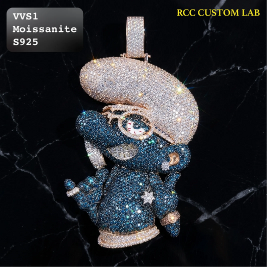 A heavily embellished moissanite and diamond astronaut pendant on a black marble background. The text overlays read 'VVS1 Moissanite S925' and 'RCC CUSTOM LAB'.