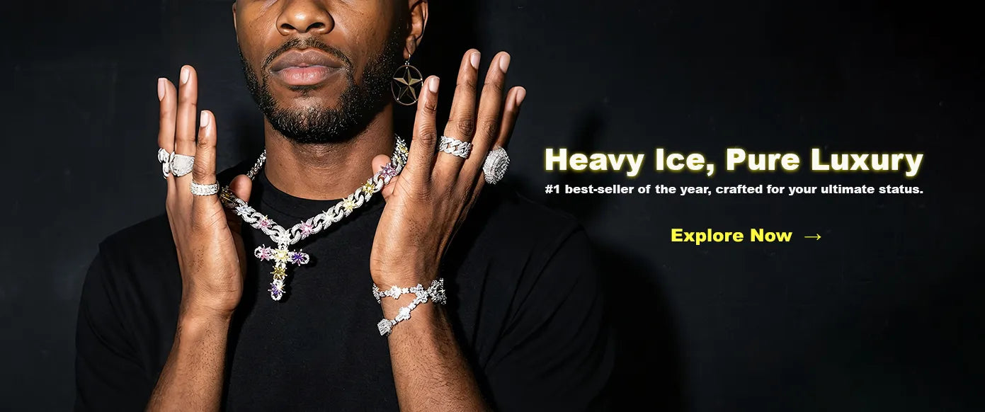 Horizontal website banner, male model displaying full set of icy hip hop jewelry including multicolor cross pendant chain, diamond rings and bracelet, slogan Heavy Ice, Pure Luxury, luxury rapper bling jewelry promotional graphic on dark background