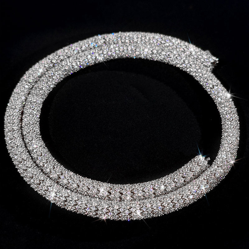 A sparkling silver-toned pave-set collar necklace displayed on a black background.