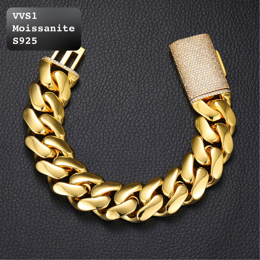 Heavy thick polished gold solid cuban link bracelet featuring fully encrusted VVS moissanite box clasp, smooth curb chain links, premium luxury men hip hop jewelry on dark leather texture