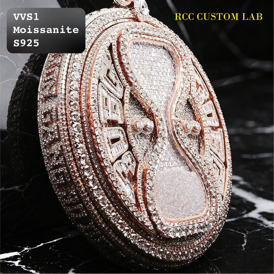 An oval pendant necklace featuring a rose gold hourglass design paved with clear stones, resting on a black marble surface. Text overlays read 'VVS1 Moissanite S925' and 'RCC CUSTOM LAB'.