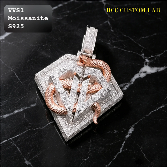 A custom Moissanite pendant by RCC Custom Lab, featuring a square diamond-encrusted setting with a rose gold snake wrapped around a central diamond 'V' monogram, displayed on a black marble background.