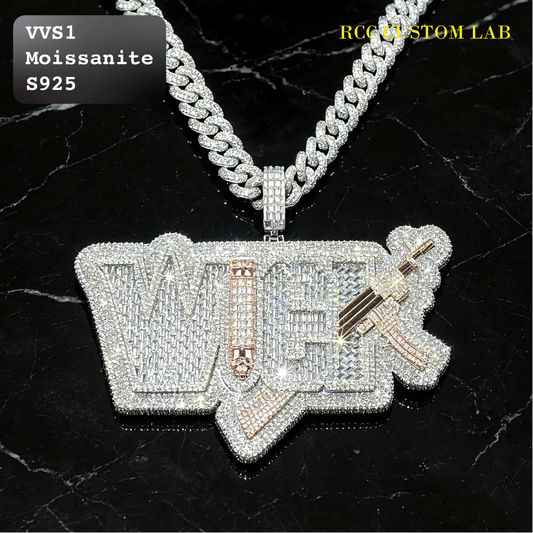 A large custom letter-shaped pendant covered in sparkling clear stones, featuring rose gold accents and a rifle motif, hanging from a thick silver chain on a black marble background. Text overlays read 'VVS1 Moissanite S925' and 'RCI CUSTOM LAB'.