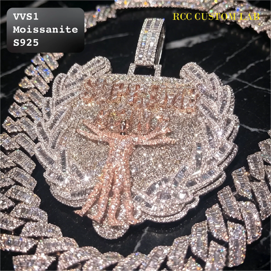 A close-up of a large, heavily embellished pendant necklace on a matching chain. The pendant features a tree design with rose gold-toned trunk and branches, surrounded by a silver-toned laurel wreath covered in clear stones.